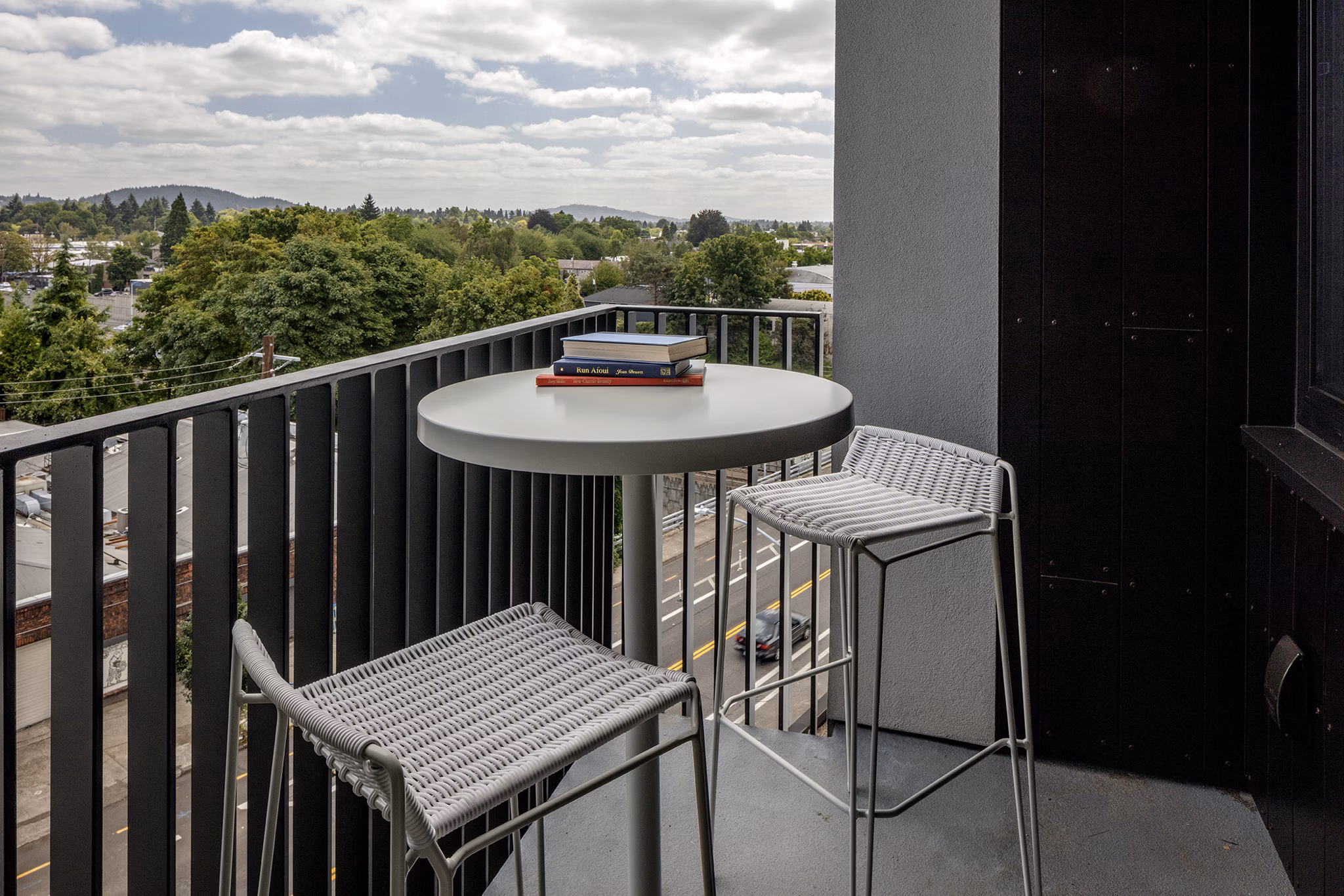 The Payton Apartments: Relaxing patio with comfortable seating and lush greenery