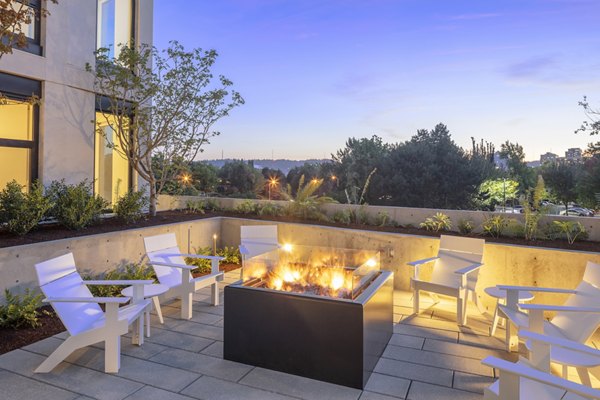Outdoor fire pit with modern seating at The Twenty Twenty luxury apartments in downtown, perfect for relaxation and socializing