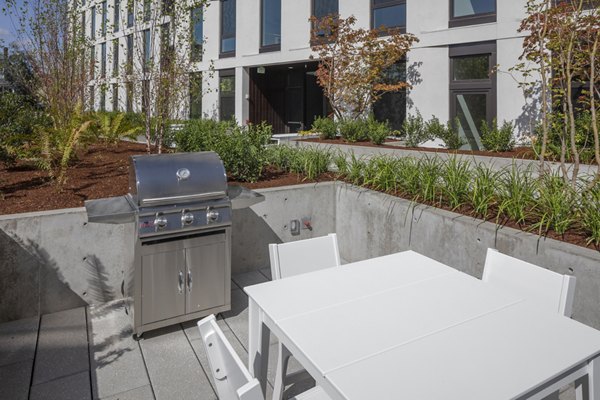Grill area featuring modern outdoor seating at The Payton luxury apartments