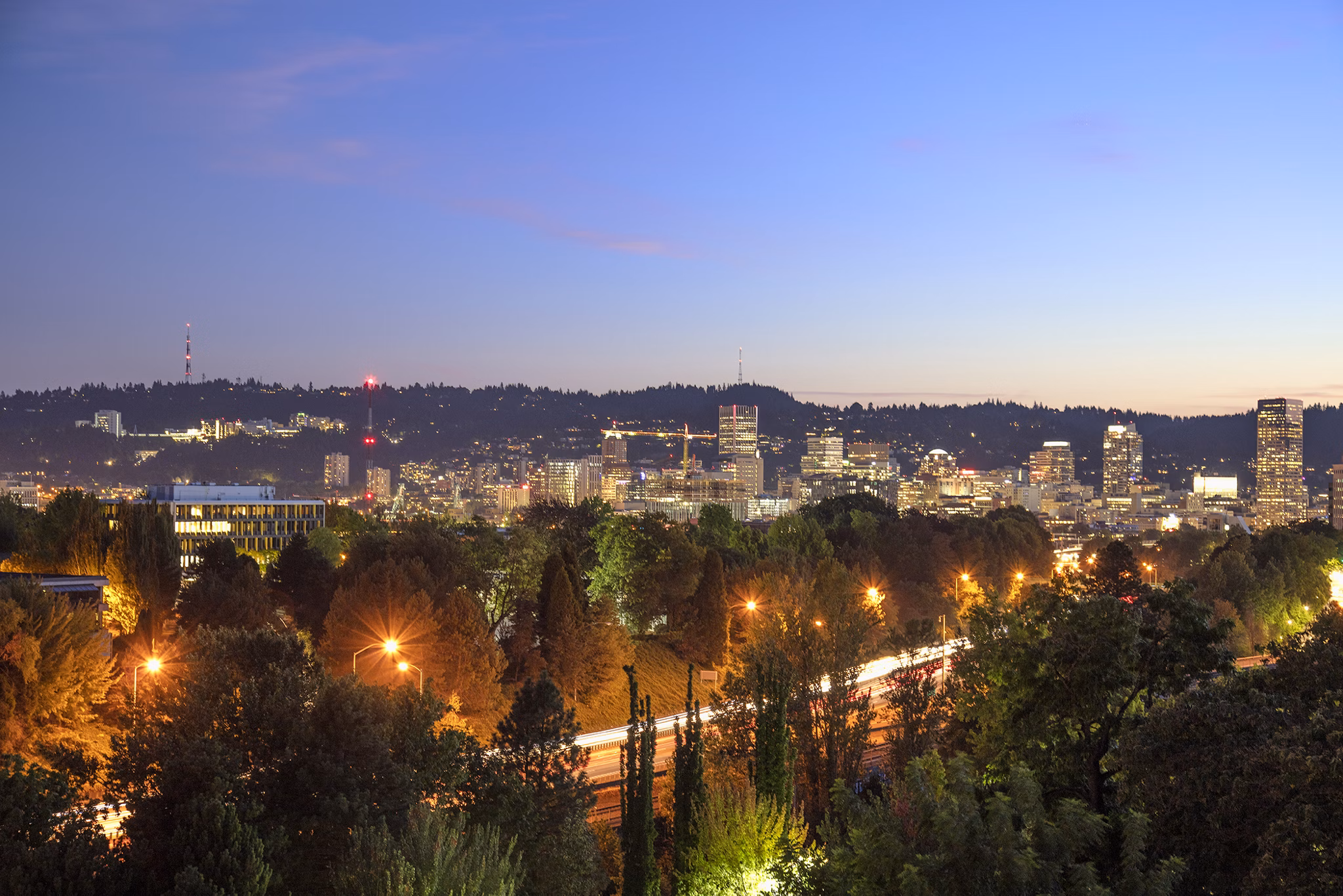 The Payton Apartments: Modern luxury apartments with glass balconies in vibrant urban setting