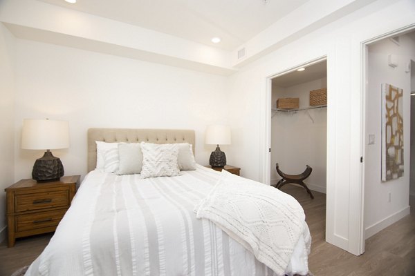 Spacious bedroom with modern decor at One38 Apartments featuring luxury amenities and urban living experience