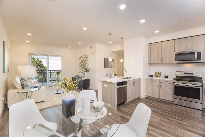 Dining area featuring elegant furnishings and modern lighting in One38 Apartments