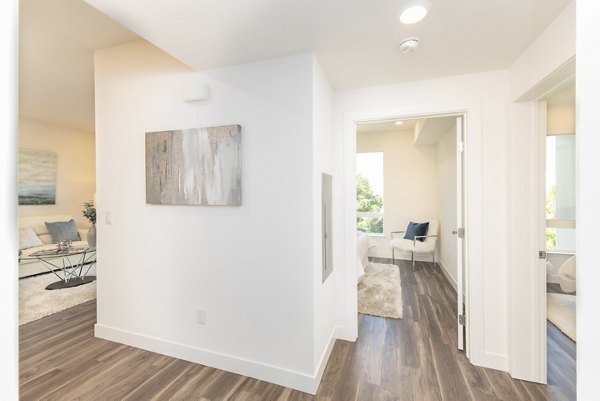 Modern kitchen with stainless steel appliances at One38 Apartments