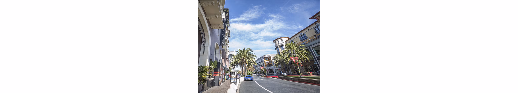 One38 Apartments: Vibrant neighborhood view featuring tree-lined streets and urban landscape, offering a lively atmosphere for residents