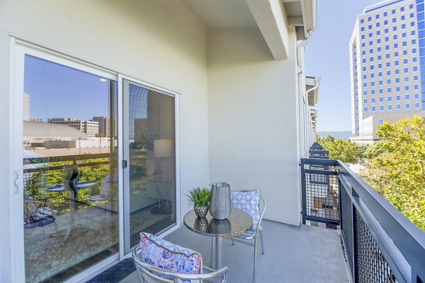 Relaxing patio with modern seating at One38 Apartments, a luxury residence by