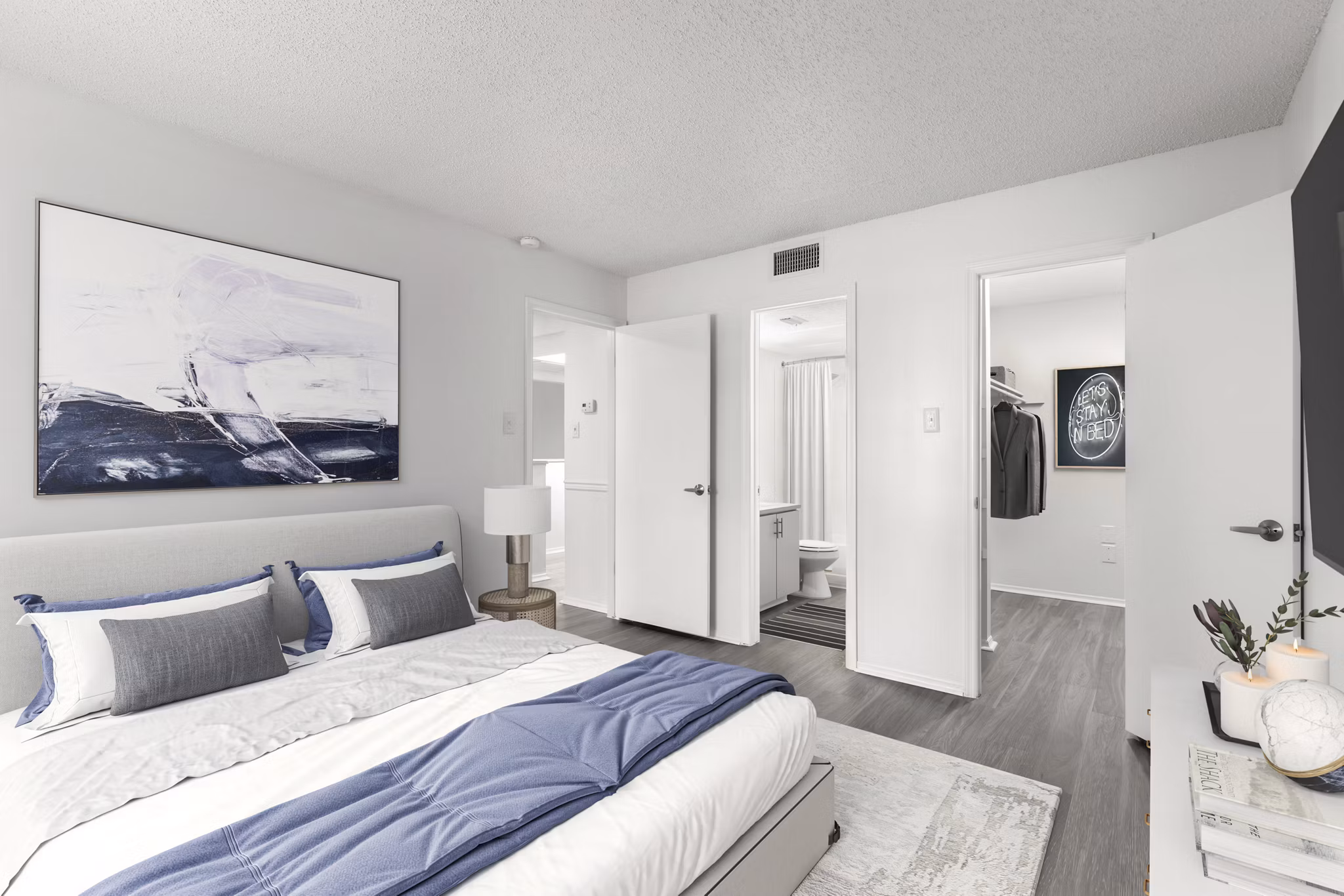 Cozy bedroom with stylish decor at Avana Coachman Apartments offering luxury living in Clearwater