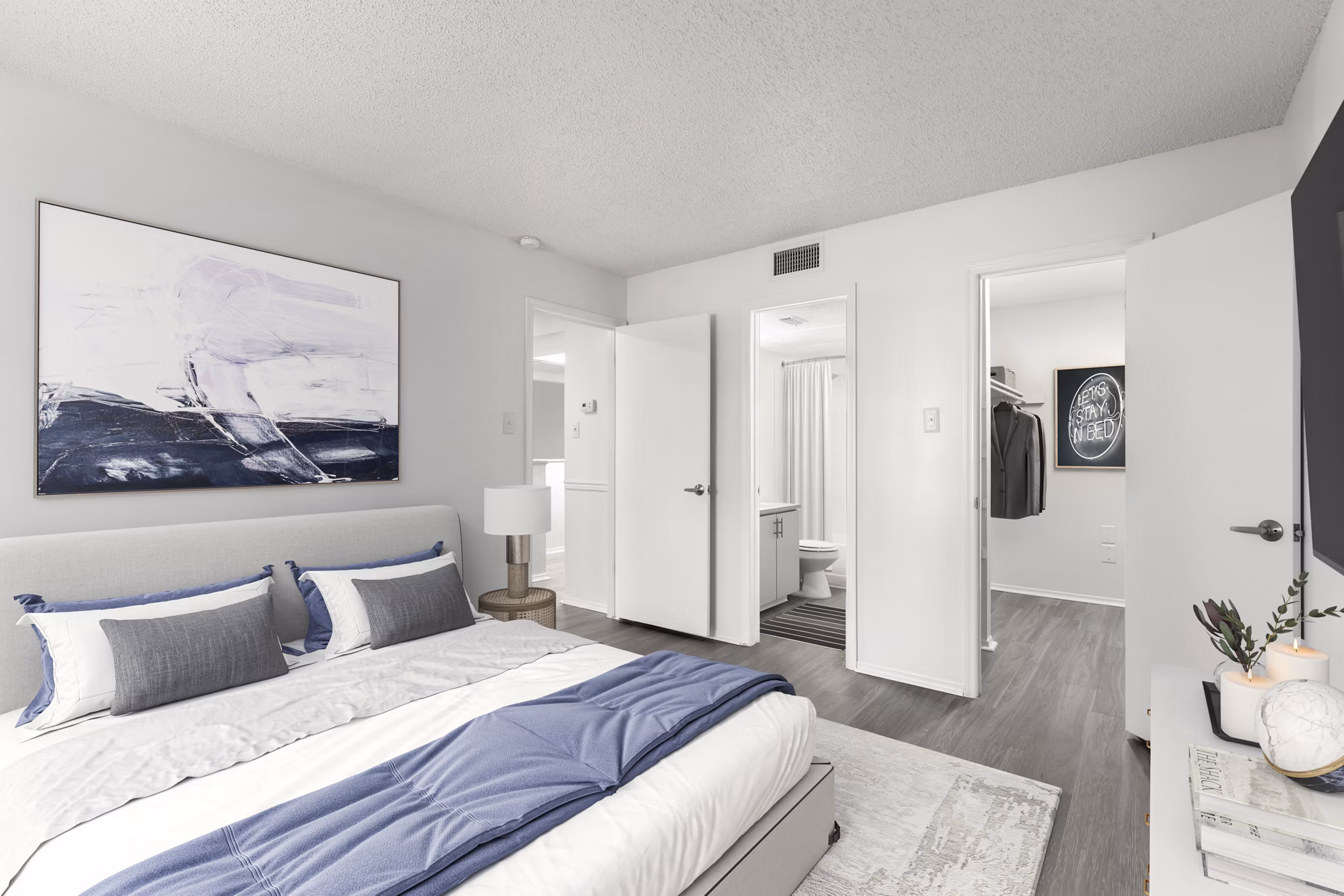 Cozy bedroom with stylish decor at Avana Coachman Apartments offering luxury living in Clearwater