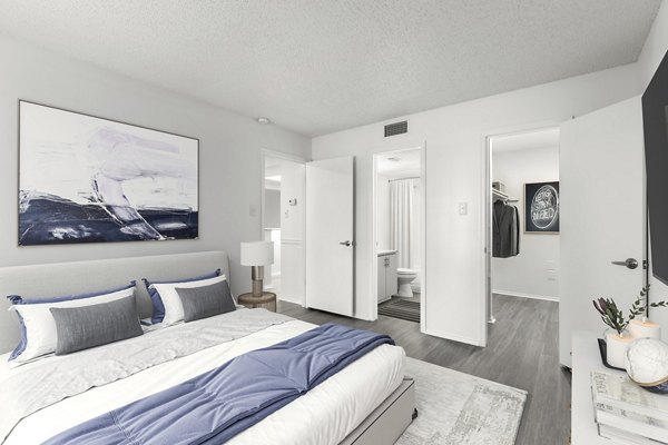 Cozy bedroom with stylish decor at Avana Coachman Apartments offering luxury living in Clearwater
