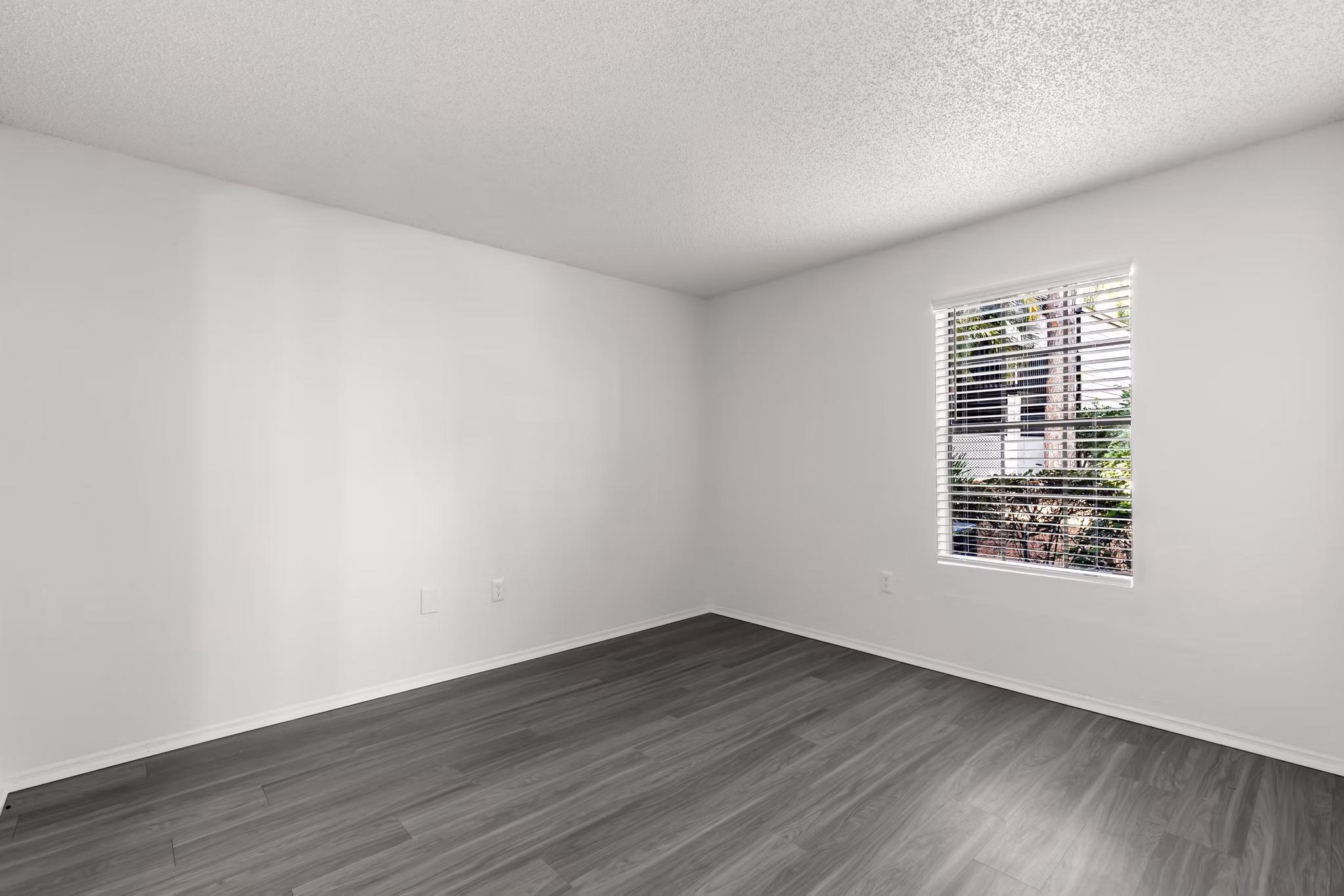 Cozy bedroom featuring elegant decor and natural light at Avana Coachman Apartments