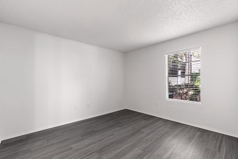 Cozy bedroom featuring elegant decor and natural light at Avana Coachman Apartments