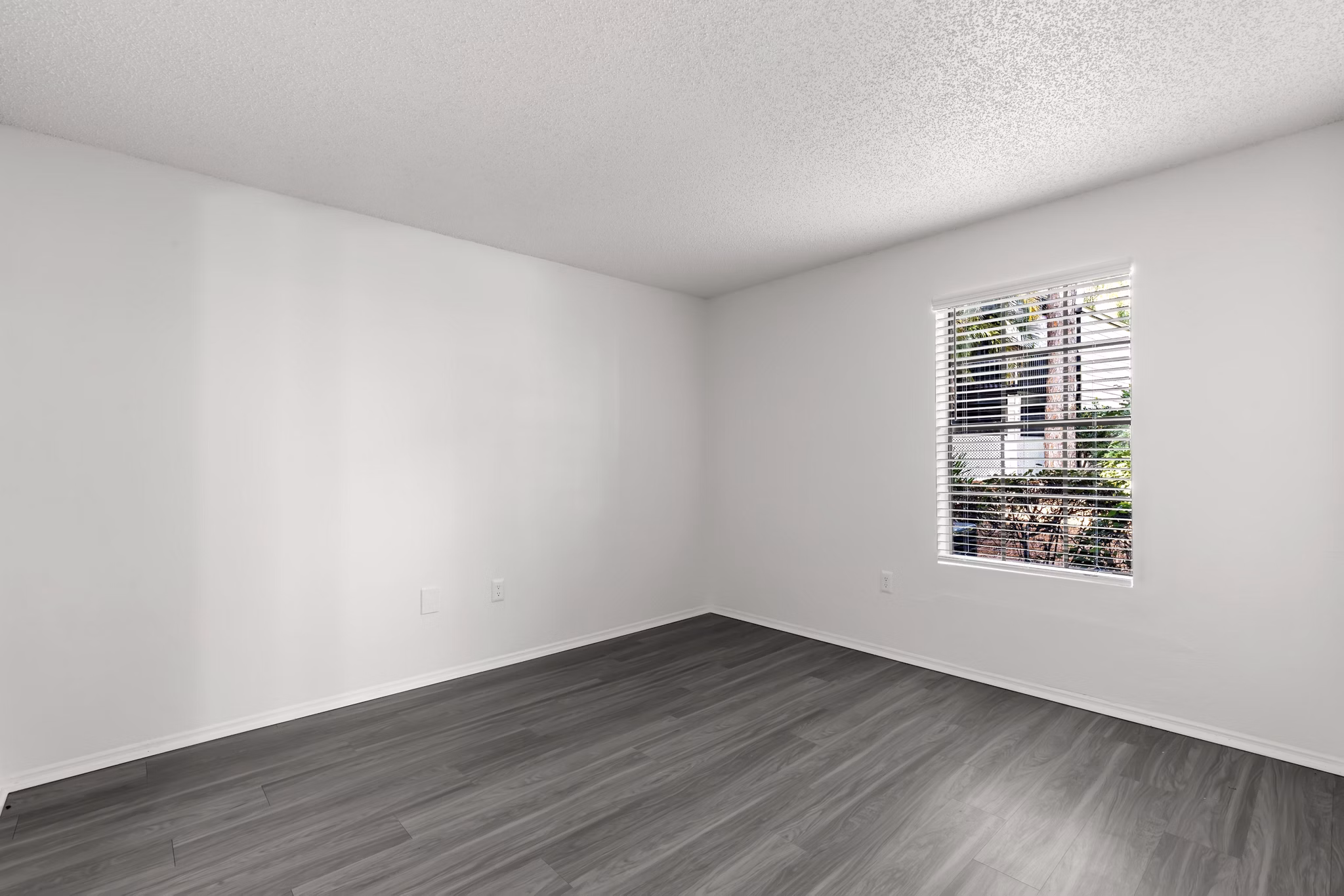 Cozy bedroom featuring elegant decor and natural light at Avana Coachman Apartments