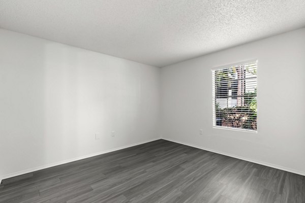 Cozy bedroom featuring elegant decor and natural light at Avana Coachman Apartments