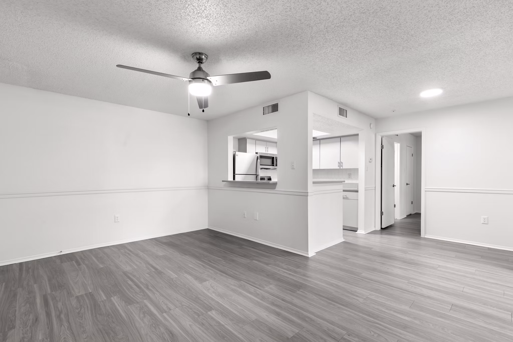 Modern kitchen with stainless steel appliances in Avana Coachman Apartments