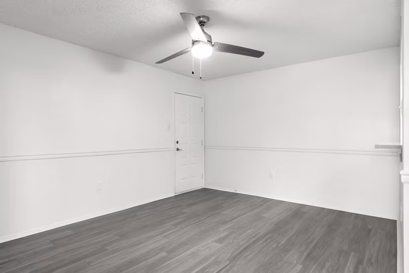 Modern kitchen with granite countertops and stainless-steel appliances at Avana Coachman Apartments