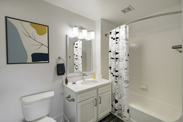 Bathroom with modern fixtures and elegant tiling at Copper Terrace Apartments, luxury living space near Denver, enhancing comfort and style