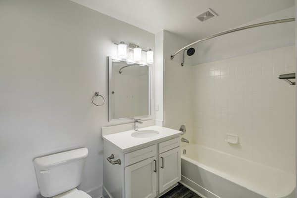 Bathroom featuring modern fixtures at Copper Terrace Apartments