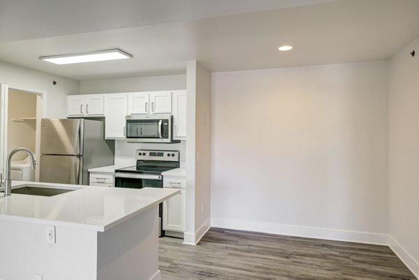 Dining area showcasing modern decor and elegant lighting at Copper Terrace Apartments, a luxury Greystar residence