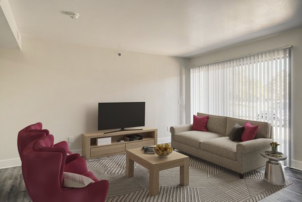 Spacious living room featuring modern furnishings in Copper Terrace Apartments, a Greystar luxury community