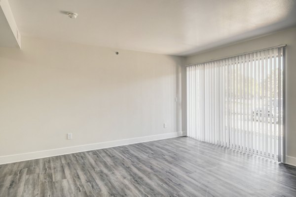 Modern living room with stylish dÃ©cor and natural light at Copper Terrace Apartments