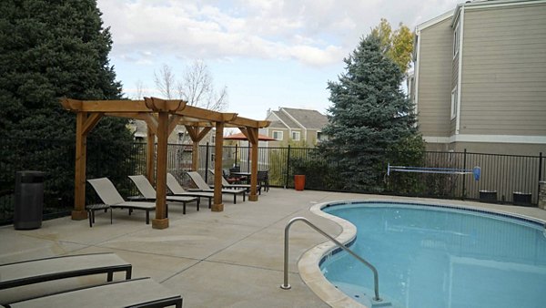 Resort-style pool with lounge chairs at Copper Terrace Apartments, offering luxury living amenities in a vibrant community setting