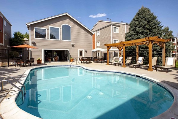Spacious poolside area at Copper Terrace Apartments with lounging options and scenic views for relaxation and entertainment