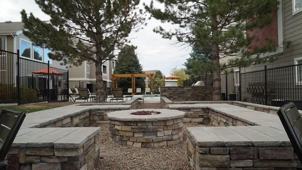 Cozy fire pit area with seating at Copper Terrace Apartments, perfect for social gatherings and relaxation