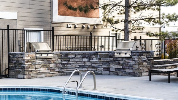 Grill patio with BBQ stations at Copper Terrace Apartments for outdoor entertaining