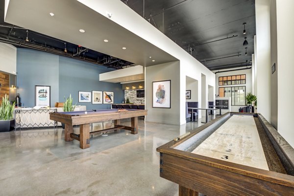 Clubhouse featuring modern seating and entertainment options at The Exchange at Bayfront Apartments