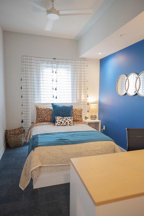 Cozy bedroom with modern decor at Cheatham Street Flats Apartments, luxury living in central location
