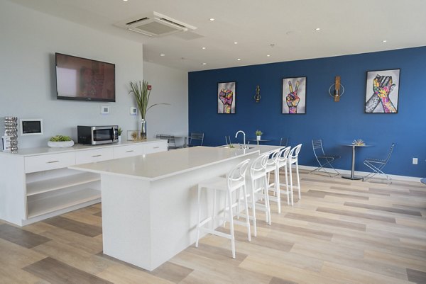 Clubhouse at Cheatham Street Flats: Modern gathering space with pool tables and seating areas in a luxury apartment community