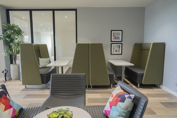 Clubhouse featuring modern lounge areas with cozy seating at Cheatham Street Flats Apartments