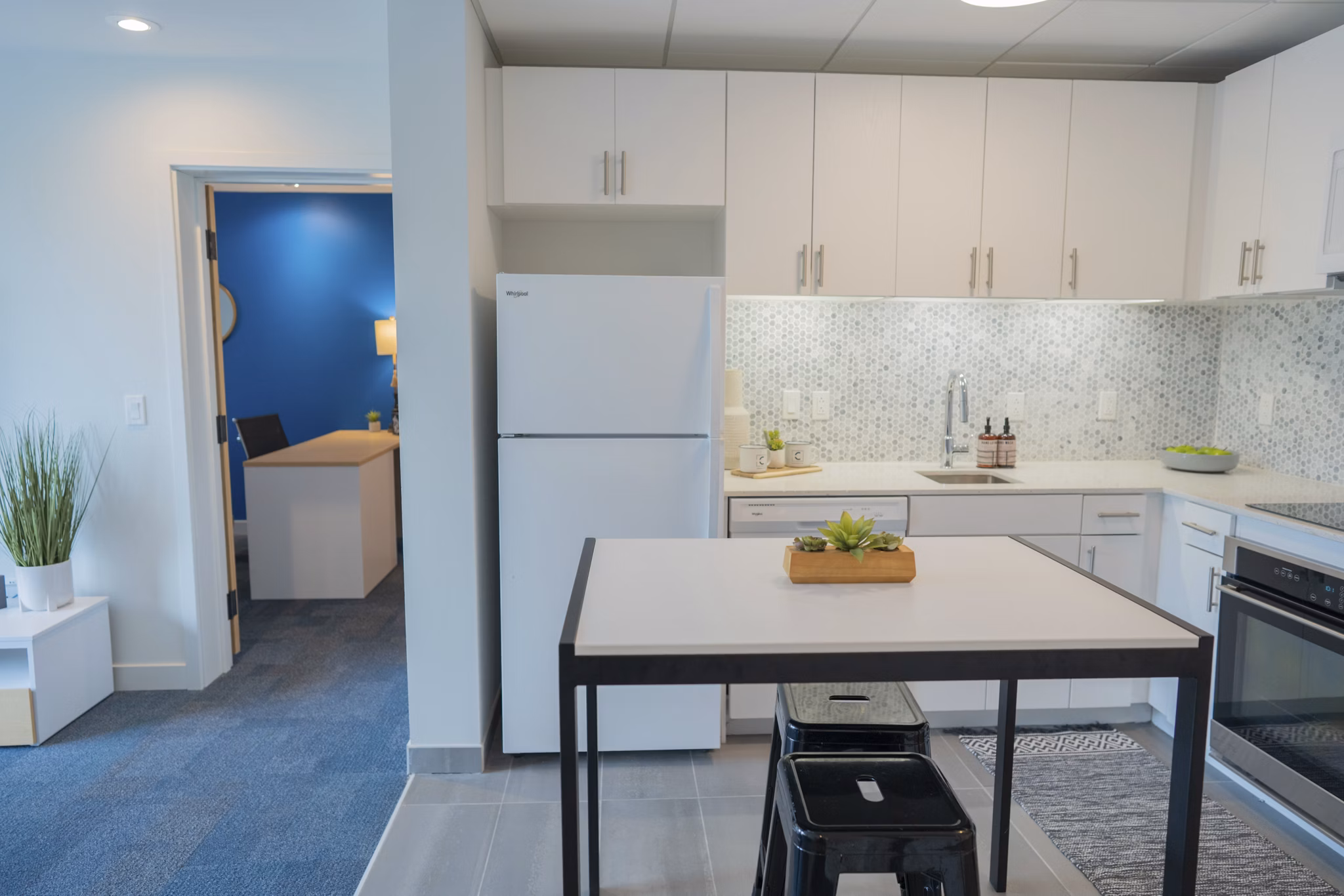 Modern kitchen with stainless steel appliances at Cheatham Street Flats Apartments