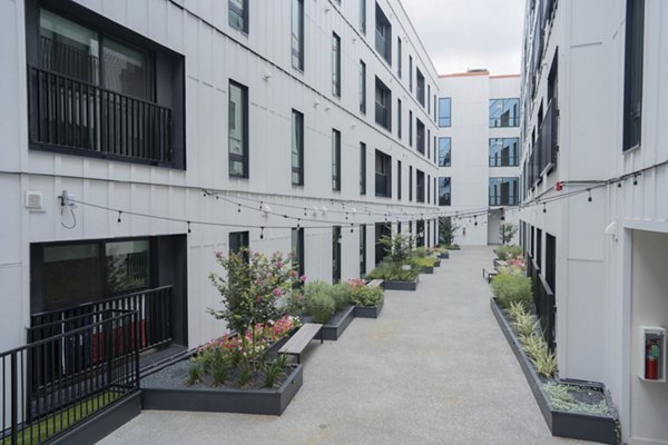 Courtyard featuring lush landscaping at Cheatham Street Flats Apartments