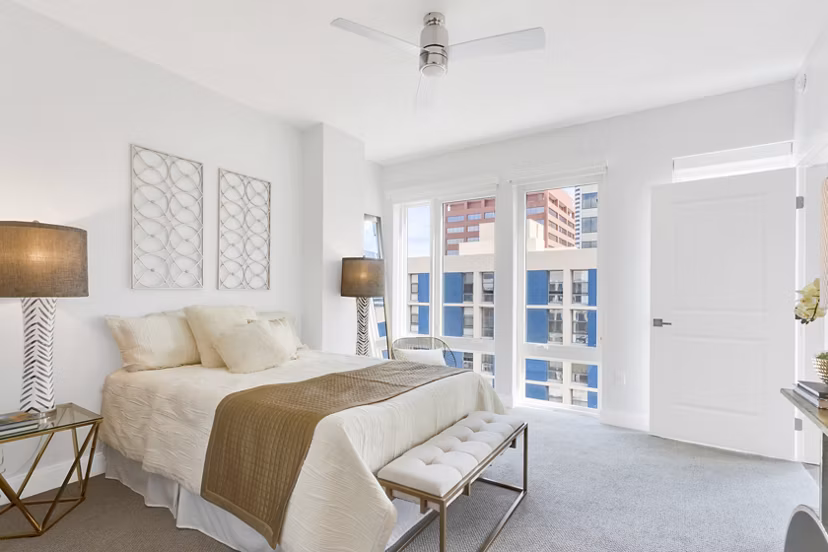 Cozy bedroom featuring modern furnishings at The Fitzgerald Apartments