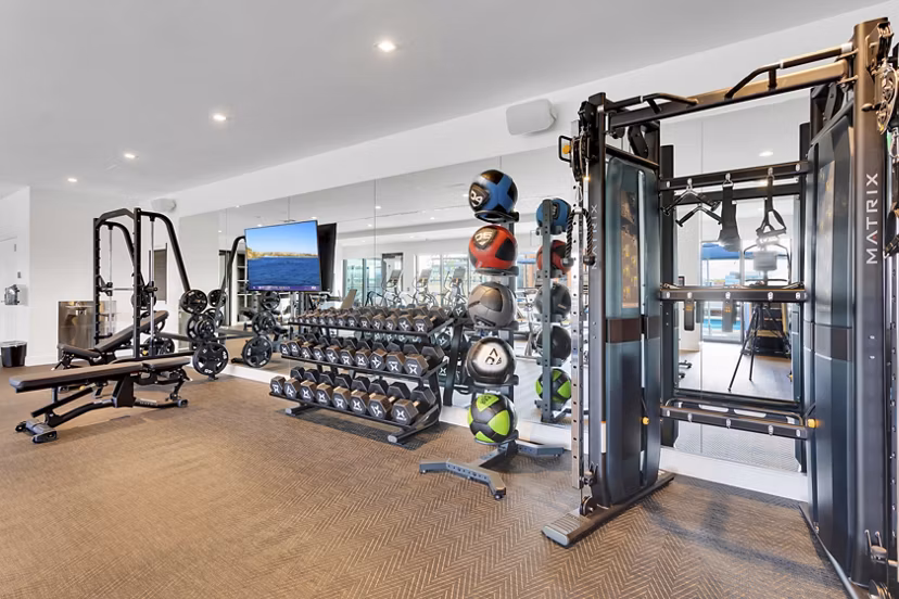 Modern fitness center with state-of-the-art equipment at The Fitzgerald Apartments