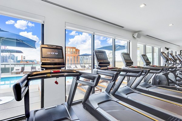 Modern fitness center with state-of-the-art equipment at The Fitzgerald Apartments