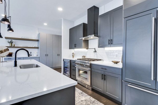Modern kitchen with stainless steel appliances at The Fitzgerald Apartments