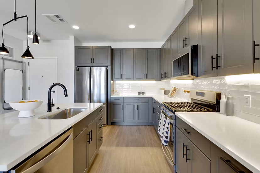 Modern kitchen with stainless steel appliances at The Fitzgerald Apartments