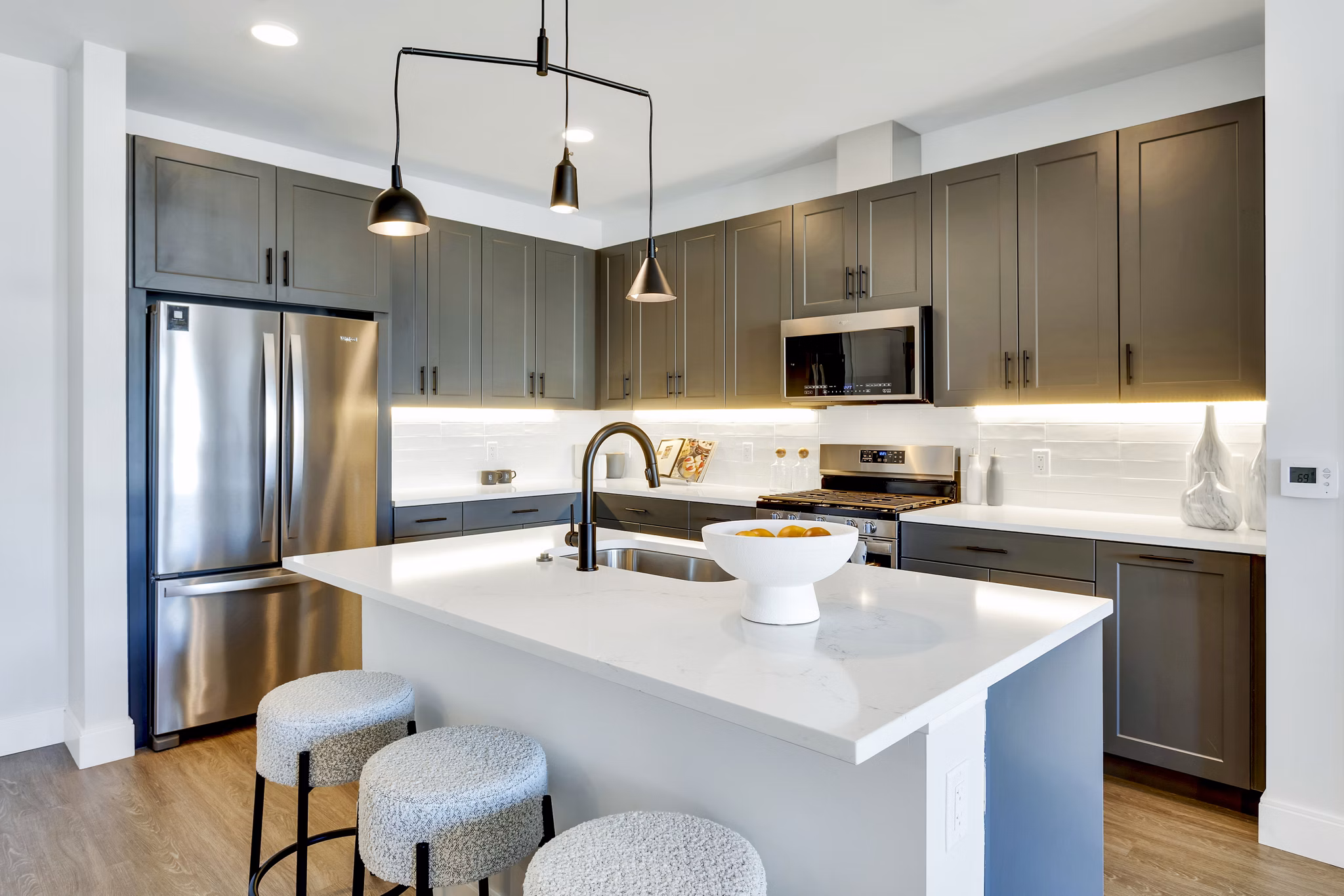 Modern kitchen with stainless steel appliances at The Fitzgerald Apartments
