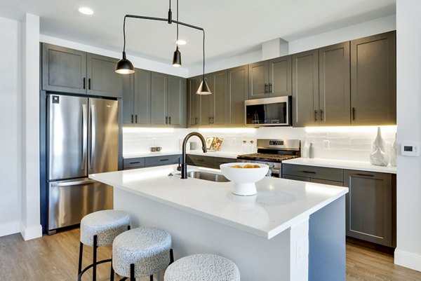 Modern kitchen with stainless steel appliances at The Fitzgerald Apartments