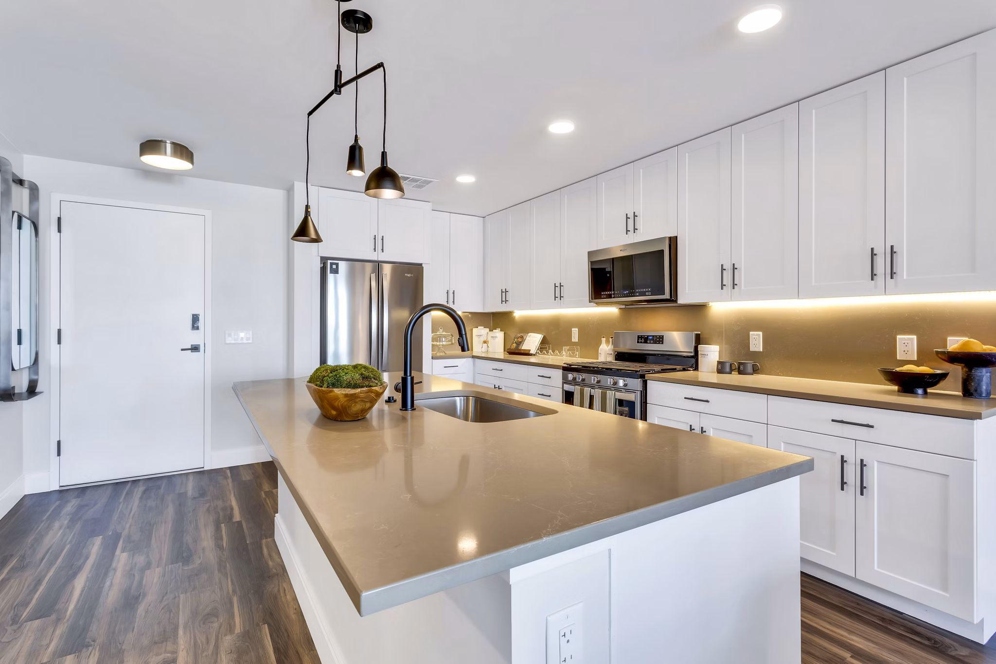Modern kitchen with stainless steel appliances at The Fitzgerald Apartments, offering stylish living spaces