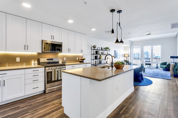 Modern kitchen with stainless steel appliances at The Fitzgerald Apartments
