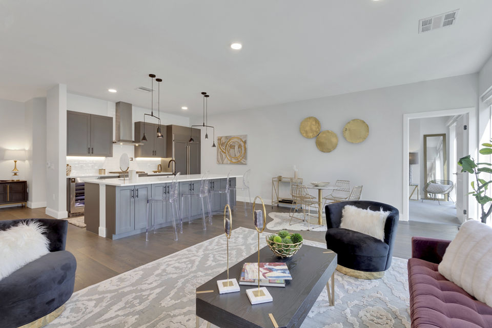 Spacious living room with modern furnishings at The Fitzgerald Apartments