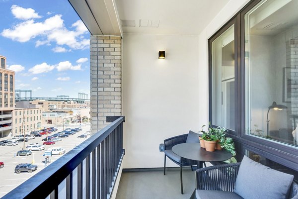 Cozy patio with modern furniture at The Fitzgerald Apartments