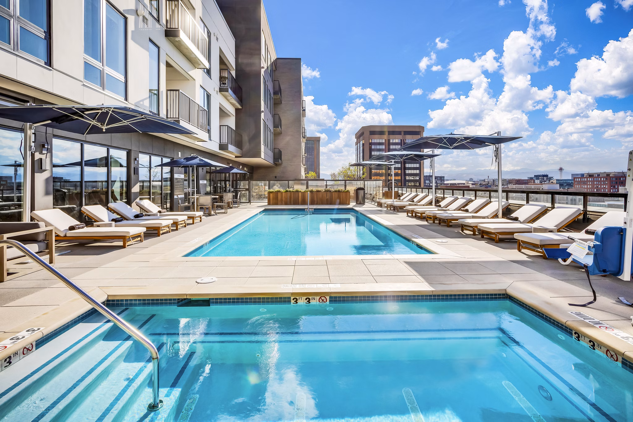 Elegant outdoor pool at The Fitzgerald Apartments offering luxury leisure experience