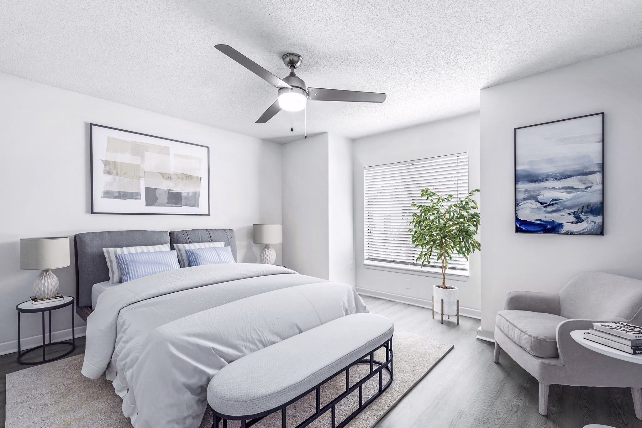 Cozy bedroom with modern decor and large windows at Avana Lakeview Apartments