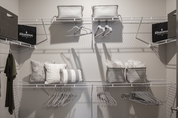 Walk-in closet with ample storage space at Westhouse Apartment Flats