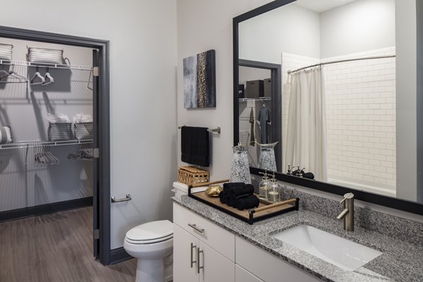 Bathroom featuring sleek fixtures and modern design in Westhouse Apartment Flats