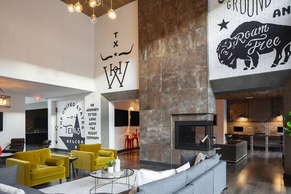Modern clubhouse with lounge seating and entertainment area at Westhouse Apartment Flats