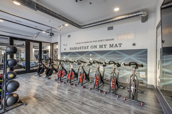 Yoga and spin studio featuring modern equipment at Westhouse Apartment Flats